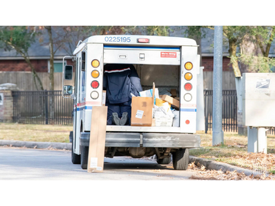 Mail truck filled with packages