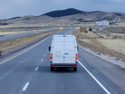 white van on highway for last mile delivery