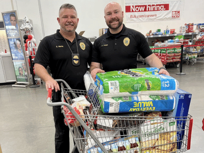 Clermont Police Officers with Hurricane Supplies from Team OneRail